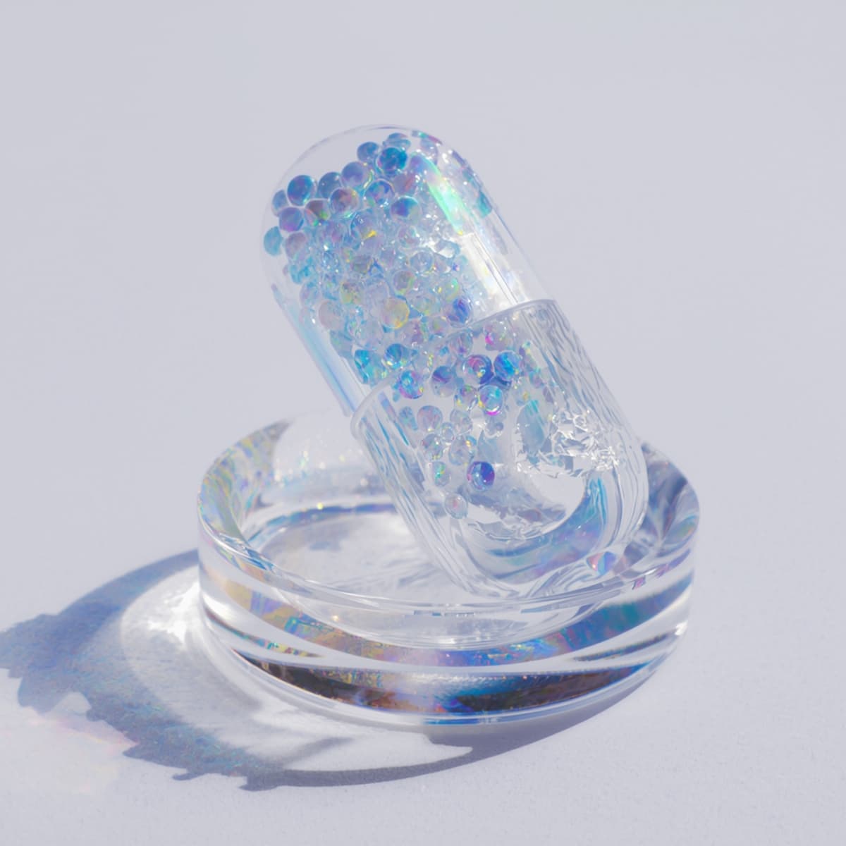 Layered blue and white abstract image representing capsule manufacturing capability